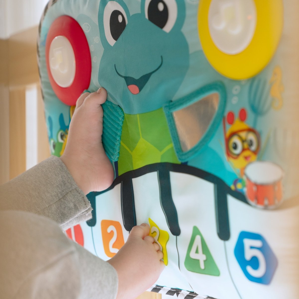 BABY EINSTEIN™ NEPTUNE’S KICK & EXPLORE MUSICAL KICK PAD AND CRIB TOY - Premium for Kids in Qatar | Toysaro.com