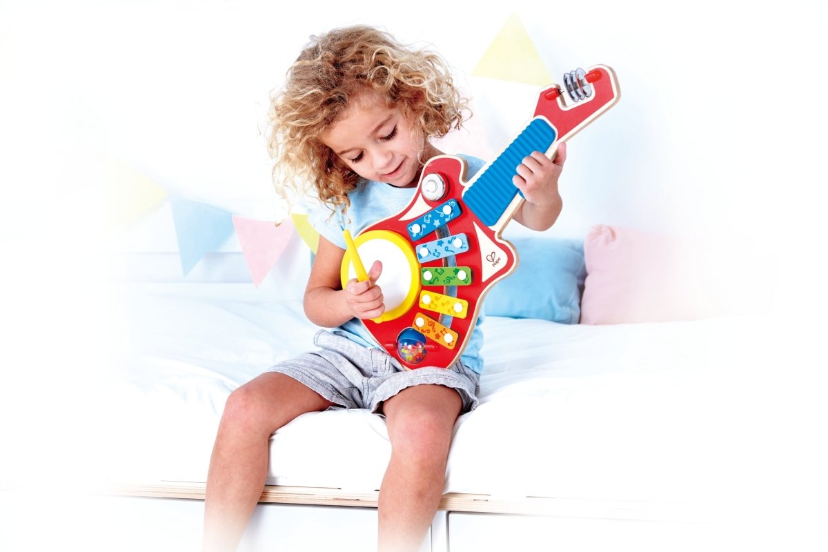 Hape - 6 - in - 1 Wooden Guitar - Shaped Music Maker Toy - Premium for Kids in Qatar | Toysaro.com