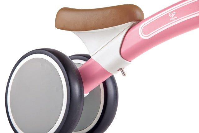 Hape Toddler Ride On Balance Bike| Adjustable and Lightweight No - Pedal Training Bike | with Silent Non - Marking Wheels | Light Pink, for Toddlers 12 Months+ - Premium for Kids in Qatar | Toysaro.com
